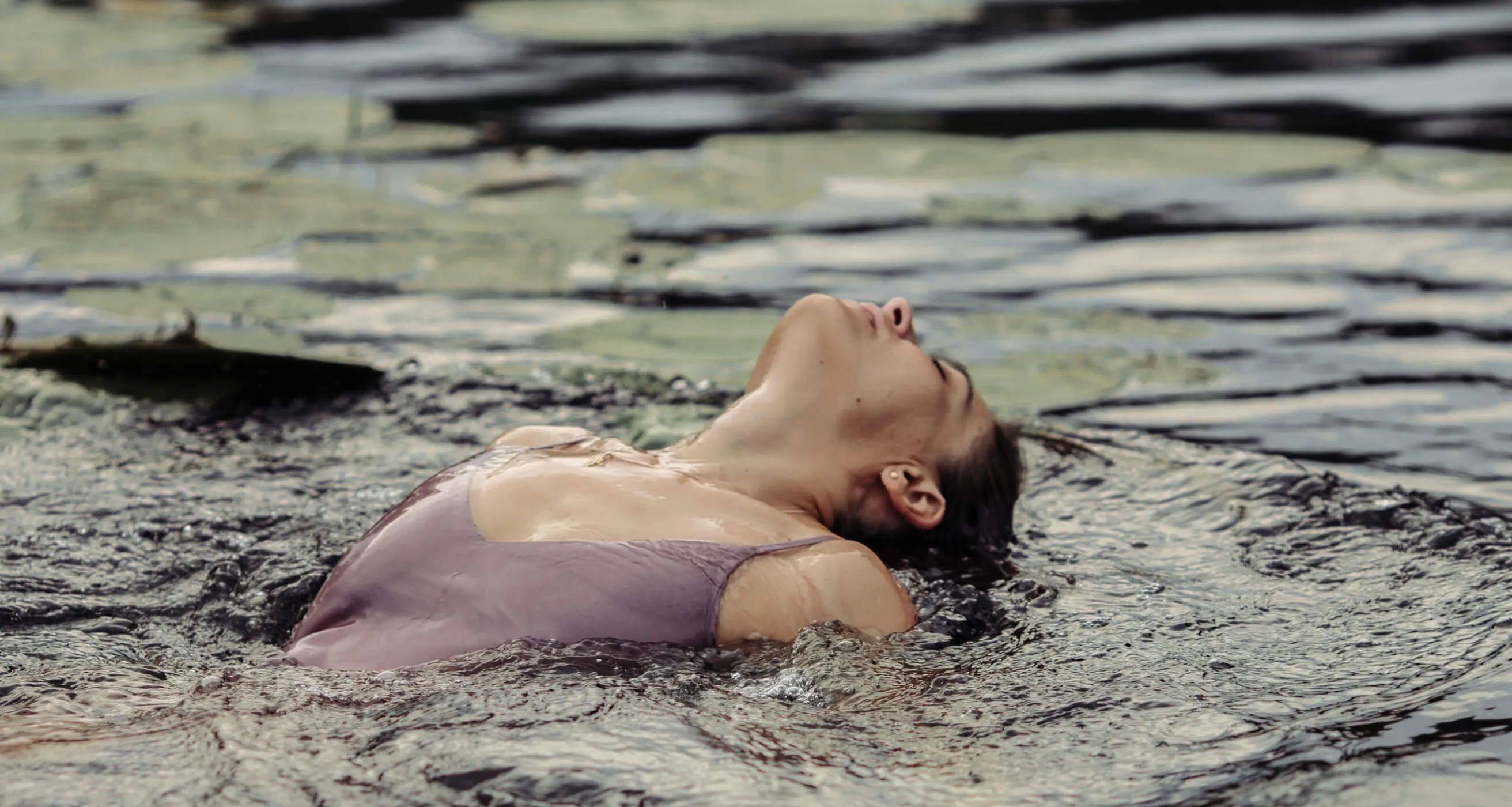 Yoga teacher Tanya swimming in a lake